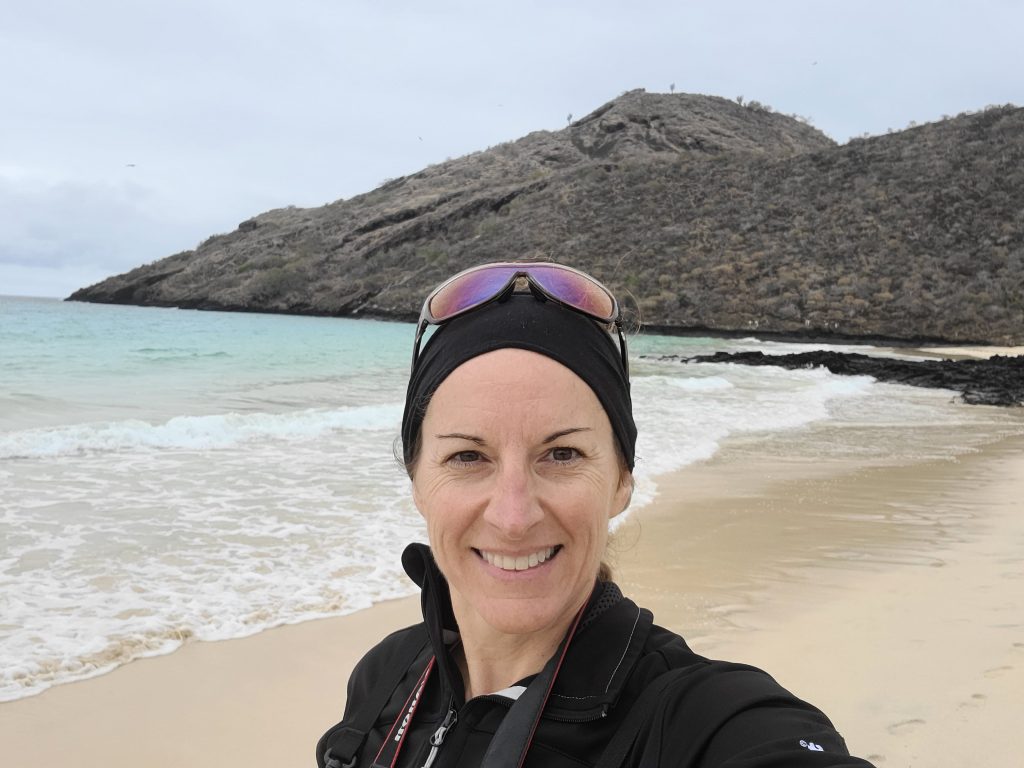 smiling woman on Galapagos beach